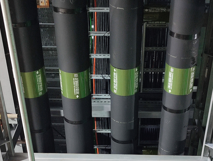 Professional ANSI compliant pipe markers installed on industrial piping systems for facility identification